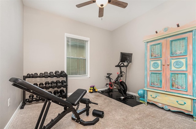 workout area featuring carpet floors, ceiling fan, and baseboards