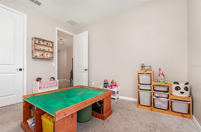 rec room with baseboards, visible vents, and carpet flooring