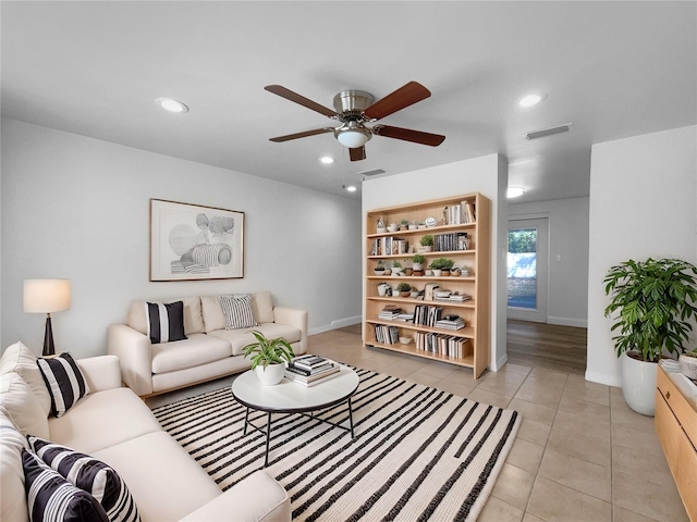 living room with light tile patterned flooring and ceiling fan