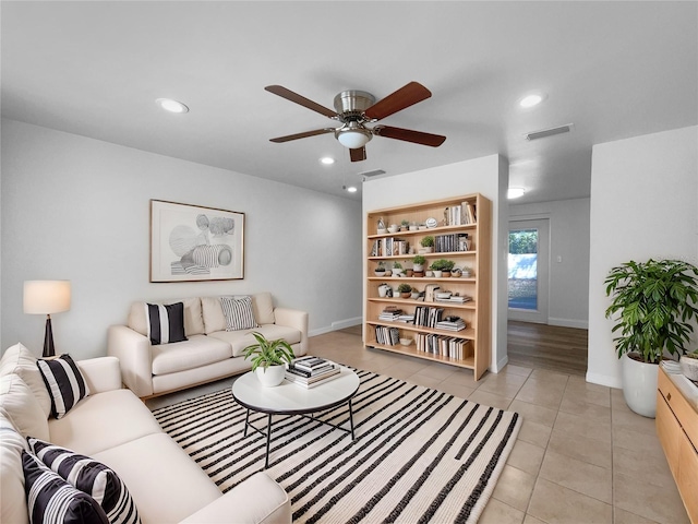 913 27th St E, Bradenton, FL 34208 - living area with light tile patterned floors, ceiling fan, baseboards, and recessed lighting