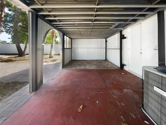913 27th St E, Bradenton, FL 34208 - view of patio / terrace with central AC and a carport