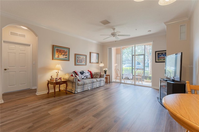 8168 Boat Hook Loop Unit 707, Windermere, FL 34786 - living area with arched walkways, ornamental molding, a ceiling fan, and wood finished floors
