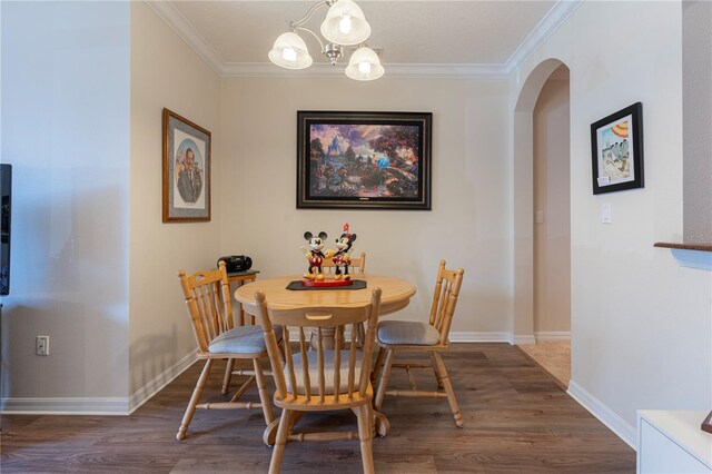 8168 Boat Hook Loop Unit 707, Windermere, FL 34786 - dining area featuring arched walkways, wood finished floors, ornamental molding, and a chandelier