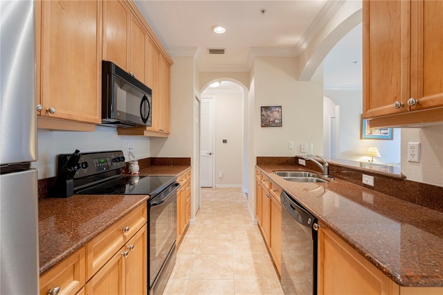 8168 Boat Hook Loop Unit 707, Windermere, FL 34786 - kitchen featuring black appliances, ornamental molding, arched walkways, dark stone counters, and light tile patterned floors