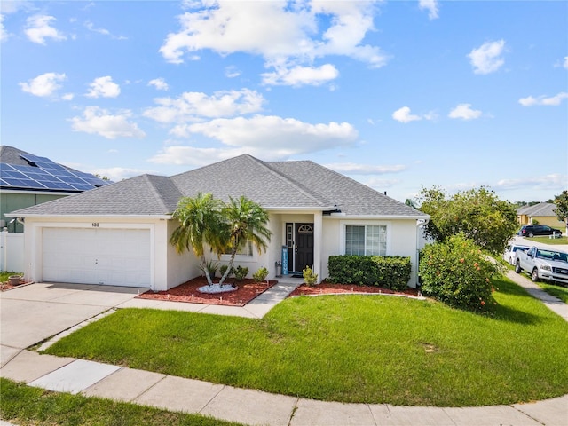 single story home with a garage and a front lawn