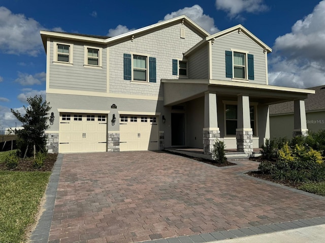 craftsman house featuring a garage and covered porch