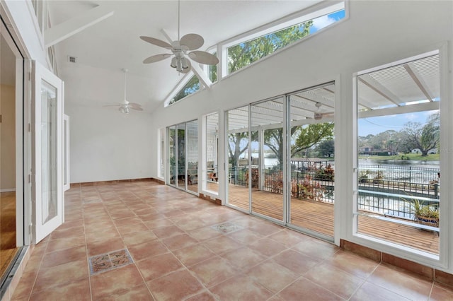 unfurnished sunroom with a ceiling fan, lofted ceiling, a water view, and visible vents