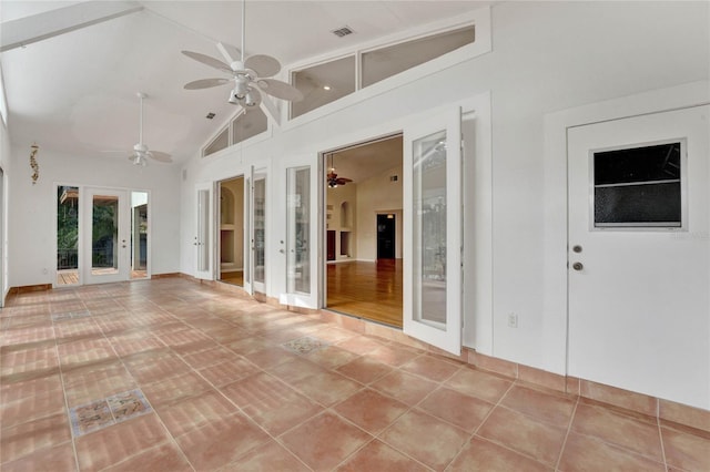 interior space featuring baseboards, visible vents, a ceiling fan, french doors, and high vaulted ceiling