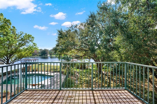 wooden terrace with a water view