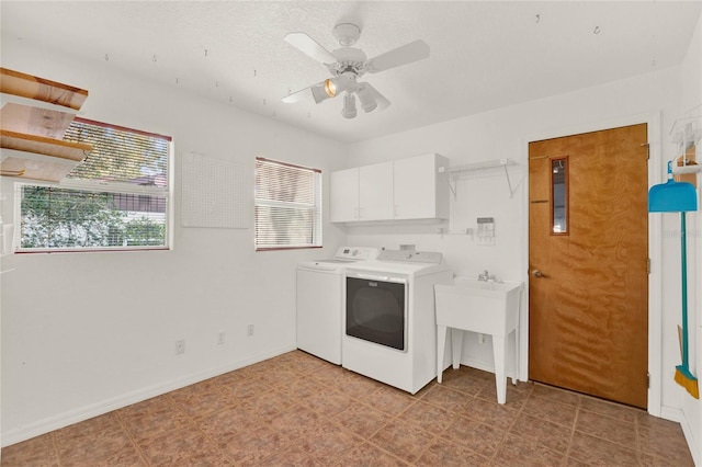 washroom with washer and dryer, cabinet space, ceiling fan, and baseboards