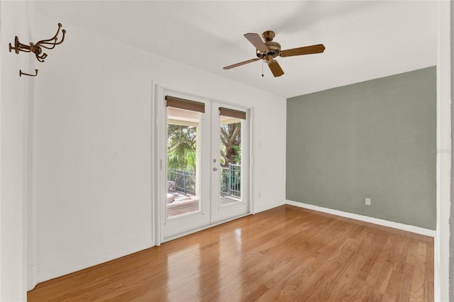 unfurnished room with french doors, baseboards, ceiling fan, and light wood finished floors