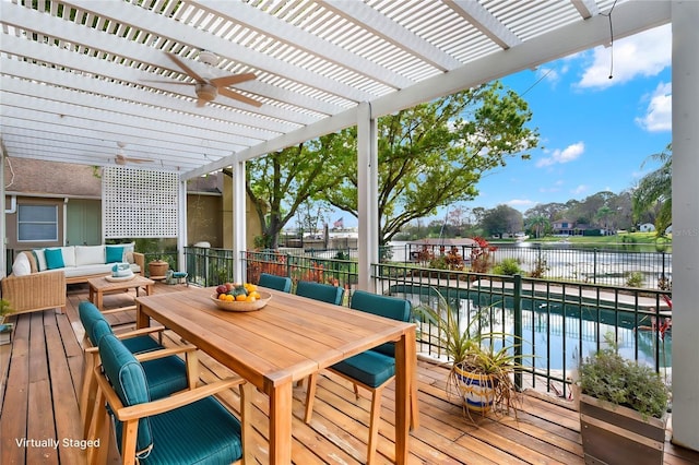 wooden deck with outdoor dining space, a water view, an outdoor hangout area, and a pergola