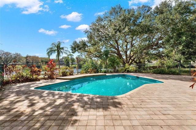 view of swimming pool featuring a fenced in pool, a patio, and fence