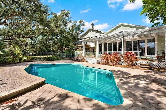 view of swimming pool with a fenced in pool, a patio area, fence, and a pergola