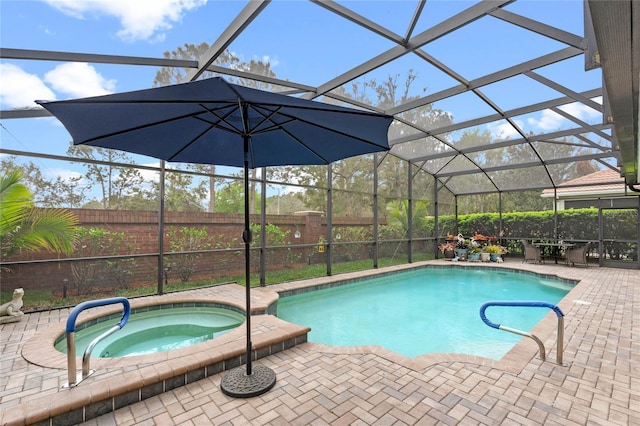 view of pool featuring a fenced in pool, a fenced backyard, an in ground hot tub, a lanai, and a patio area