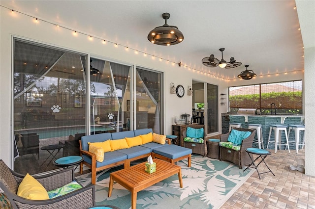 view of patio / terrace with outdoor lounge area, ceiling fan, and outdoor dry bar