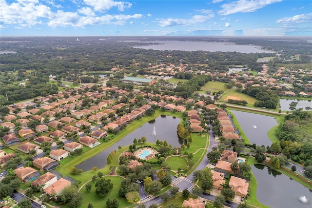 drone / aerial view with a residential view and a water view