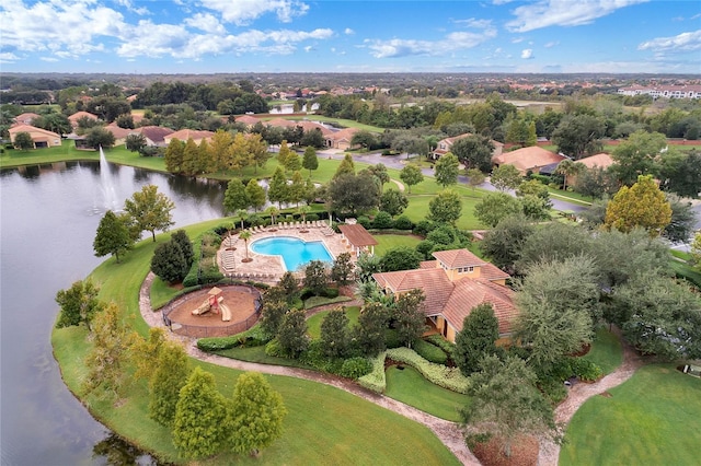 birds eye view of property with a water view