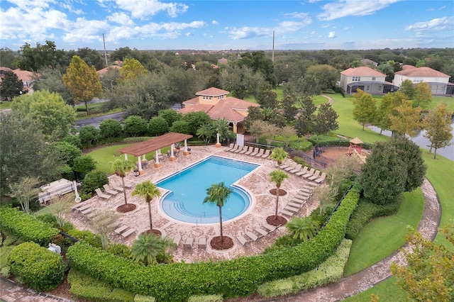 pool featuring a pergola and a patio