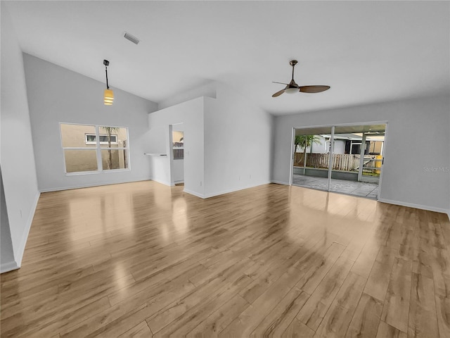 unfurnished living room featuring ceiling fan, light hardwood / wood-style floors, and vaulted ceiling