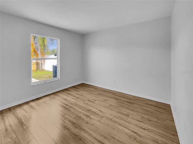 unfurnished room featuring light hardwood / wood-style floors