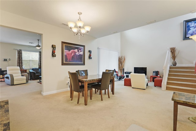 dining area with a notable chandelier, visible vents, light carpet, baseboards, and stairs