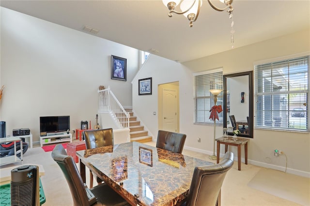 dining space featuring visible vents, baseboards, stairway, carpet, and a notable chandelier