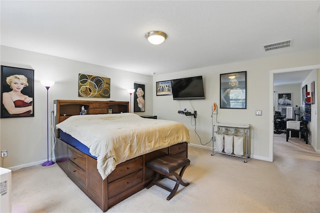 bedroom with light colored carpet, visible vents, and baseboards