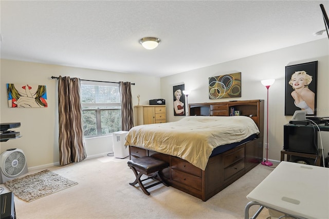 bedroom featuring baseboards, a textured ceiling, and light colored carpet