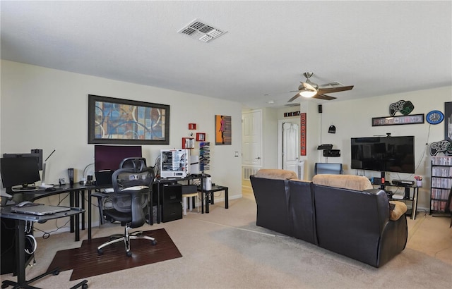 living room with light colored carpet, visible vents, a ceiling fan, a textured ceiling, and baseboards