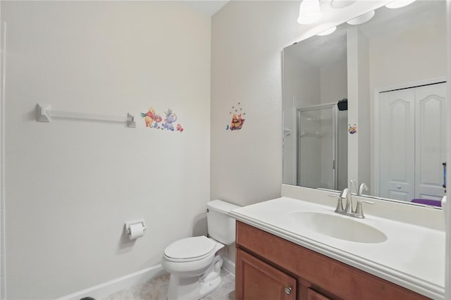 full bathroom with toilet, a shower stall, vanity, tile patterned flooring, and baseboards