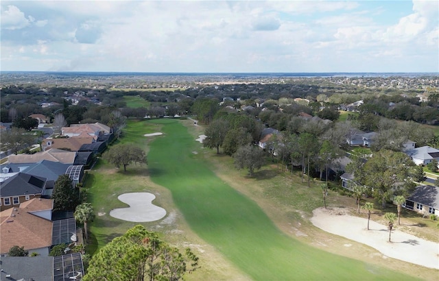 birds eye view of property with view of golf course and a residential view