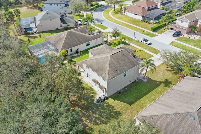 birds eye view of property with a residential view