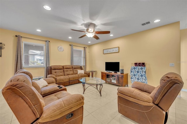 15506 Gemini Dr, Mascotte, FL 34753 - living room featuring light tile patterned floors and ceiling fan
