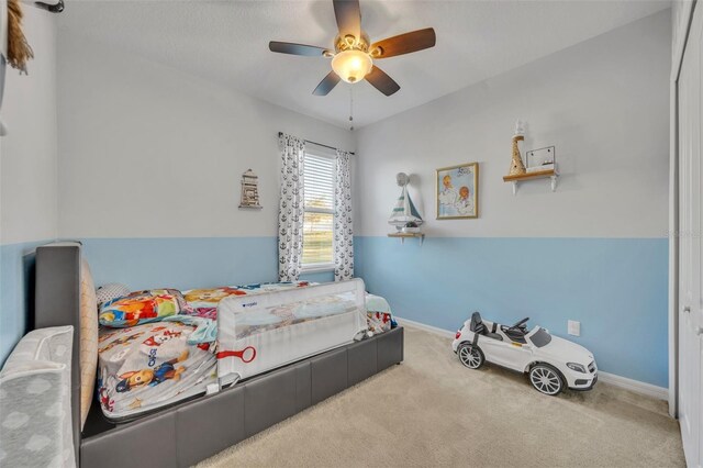 15506 Gemini Dr, Mascotte, FL 34753 - bedroom featuring ceiling fan and carpet floors