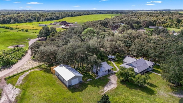 birds eye view of property with a forest view