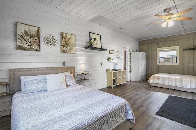 bedroom with wooden ceiling, ceiling fan, dark wood finished floors, and cooling unit