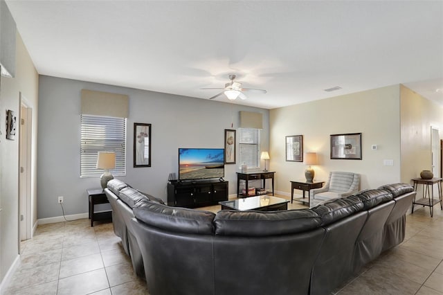 tiled living room with ceiling fan