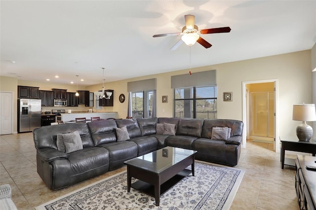 tiled living room featuring ceiling fan