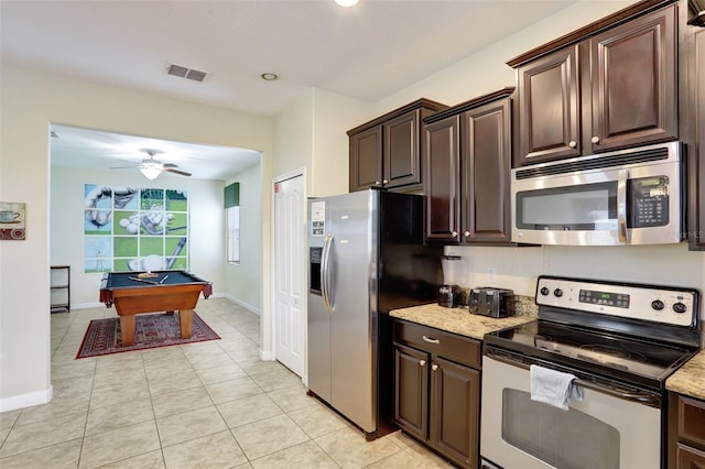 kitchen featuring dark brown cabinetry, light stone countertops, billiards, and appliances with stainless steel finishes