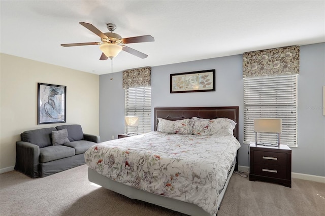 bedroom with light carpet and ceiling fan