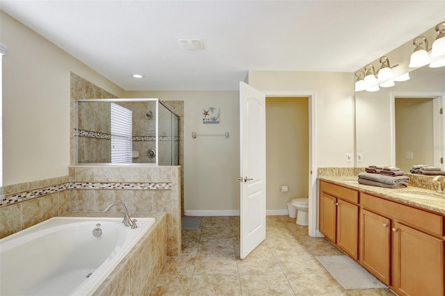 full bathroom with tile patterned flooring, vanity, shower with separate bathtub, and toilet