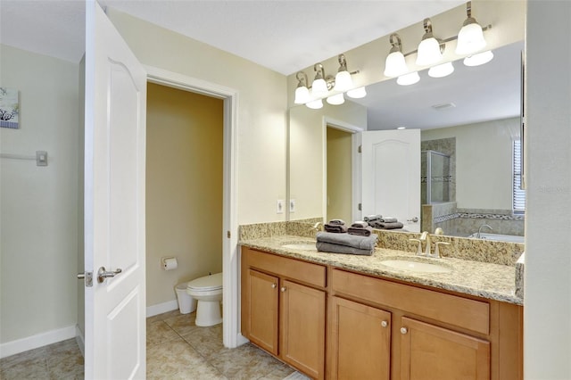 bathroom with vanity, tile patterned flooring, a shower with door, and toilet