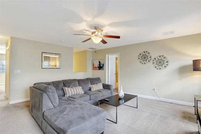 carpeted living room featuring ceiling fan