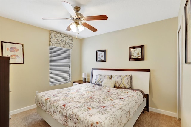 bedroom featuring light carpet and ceiling fan