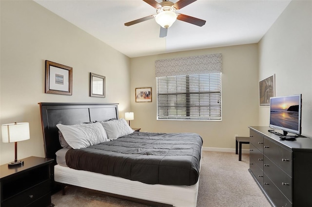 bedroom featuring light carpet and ceiling fan