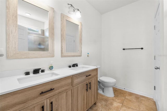 231 Turtle Cv, Panama City Beach, FL 32413 - bathroom featuring tile patterned flooring, vanity, an enclosed shower, and toilet