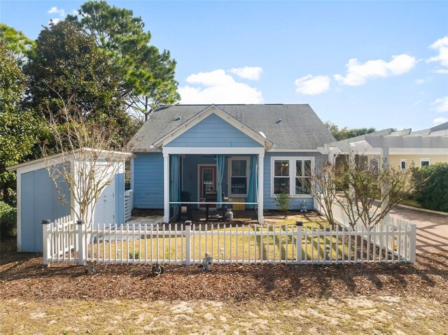 231 Turtle Cv, Panama City Beach, FL 32413 - bungalow-style home with a sunroom