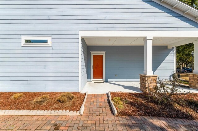 231 Turtle Cv, Panama City Beach, FL 32413 - view of exterior entry with covered porch