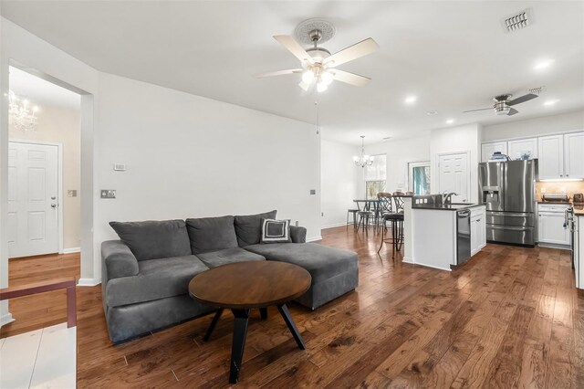 231 Turtle Cv, Panama City Beach, FL 32413 - living room with sink, ceiling fan with notable chandelier, and dark hardwood / wood-style floors